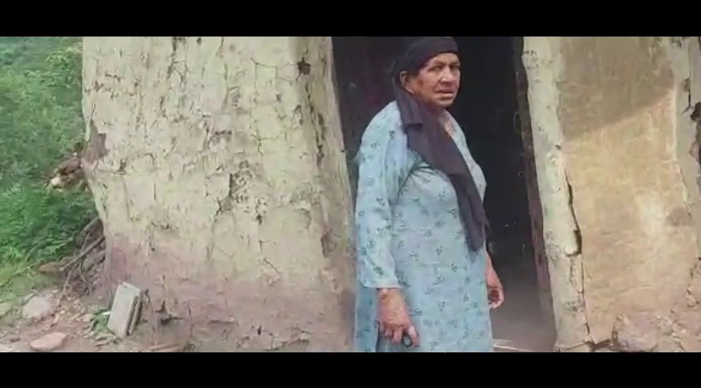 Old helpless widow woman in district Solan, forced to live alone in a broken house